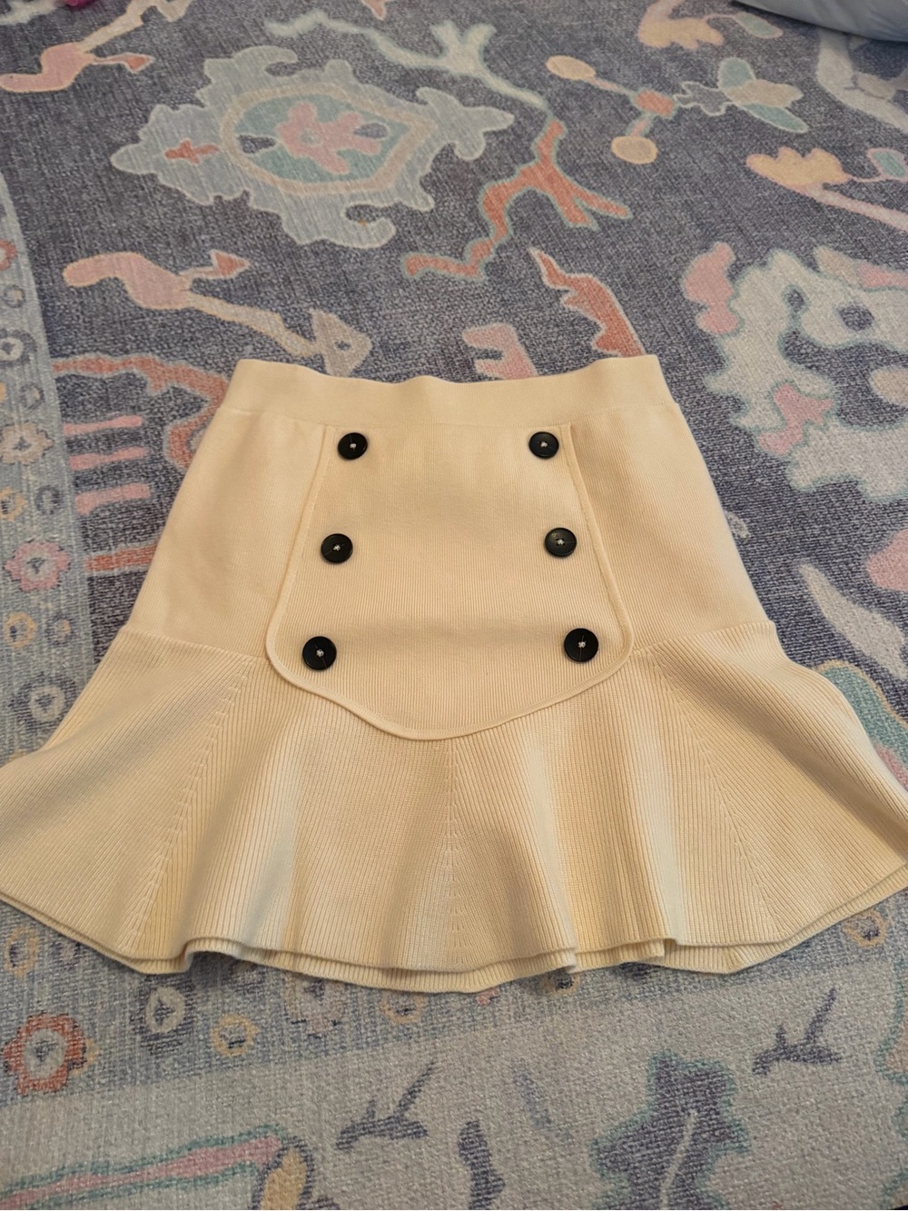 Maeve Cream Knit Peplum Mini Skirt with Black Buttons